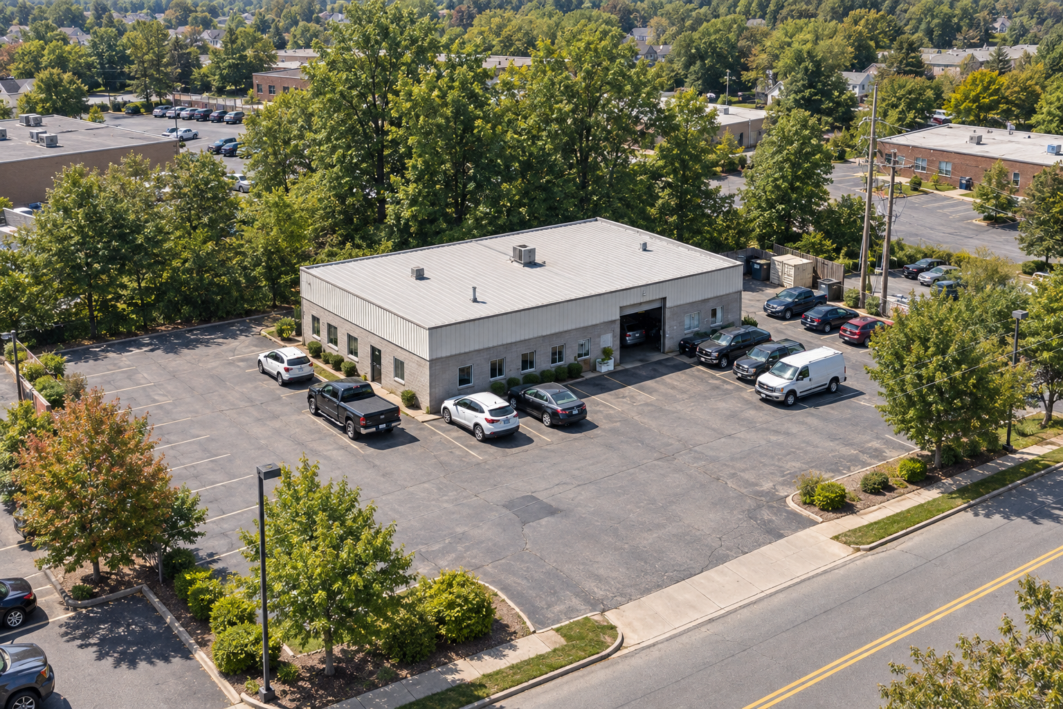 Illustrative elevated aerial view of a New Jersey automotive repair property, showing its roof, service bays and vehicle parking